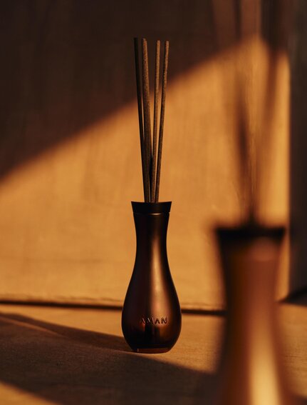 Aman resort amenities and essentials with warm golden light