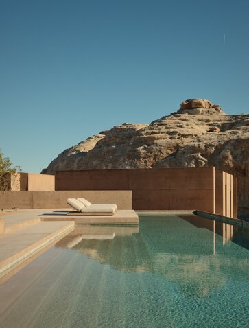 Desert pool and sandstone cliffs at Amangiri resort, Utah