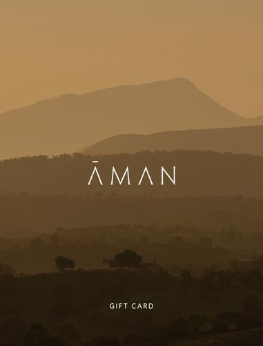 Aman gift card with golden hills landscape and Aman wordmark