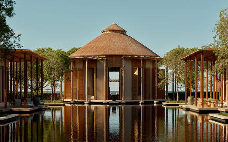 Amanyara resort pavilion reflected in still water at sunset, Turks and Caicos